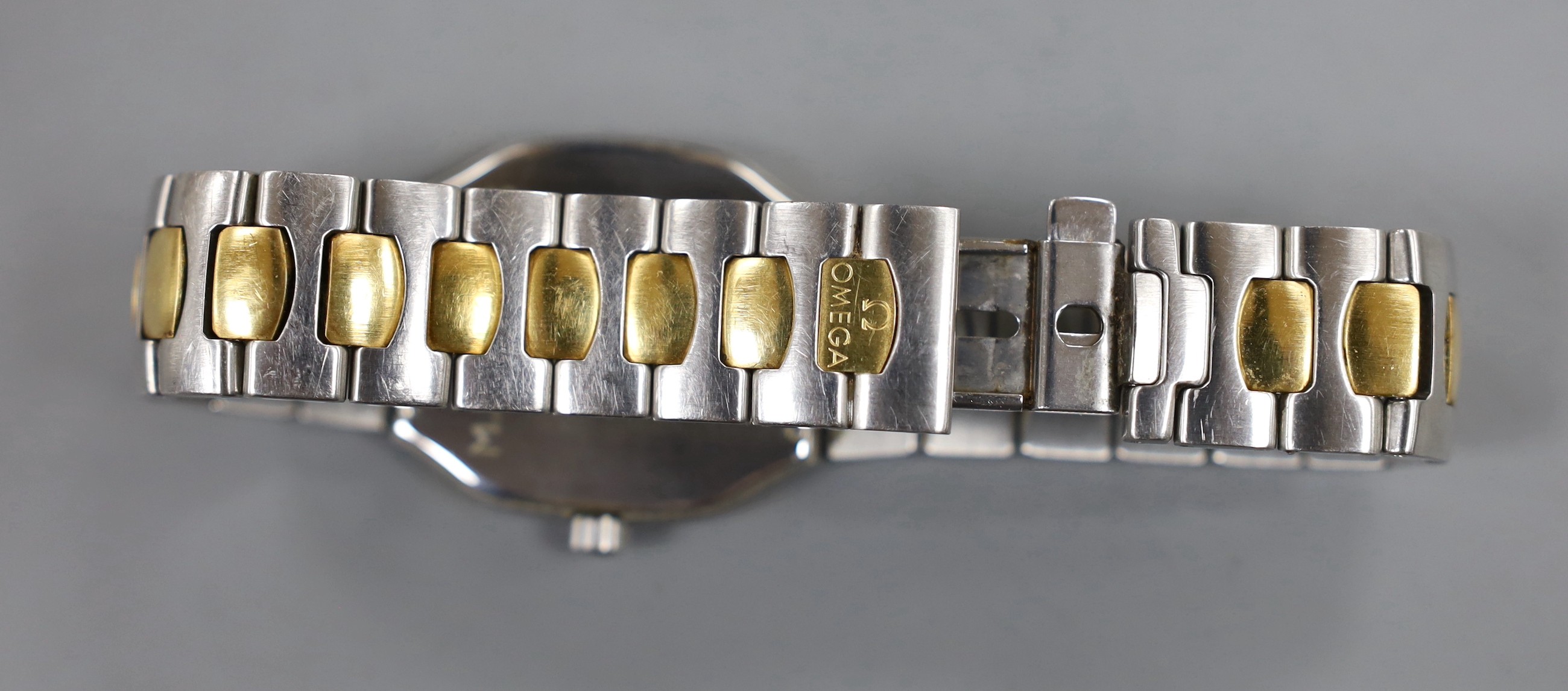 A gentleman's modern steel and gold plated Omega Seamaster quartz wrist watch, case diameter 32mm, with box, no papers.